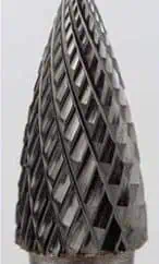 Knurled metal drill bit with textured surface for enhanced grip and precision in metalworking applications.
