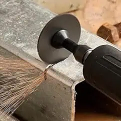 Precision metal cutting using an angle grinder with sparks flying, showcasing industrial power tools for advanced manufacturing and fabrication processes.