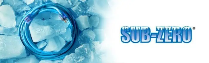 Blue network cable coiled on ice with frozen background, emphasizing durability in cold environments for NIS tools and networking equipment.