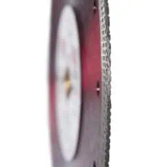 Saw blade with sharp teeth for cutting, used in woodworking and construction tools, close-up shot showing detailed edge and metallic surface.