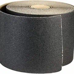 Black anti-slip safety tape roll for flooring and stairs, providing enhanced grip and visibility. Ideal for industrial, commercial, and residential safety applications to prevent slips and falls.