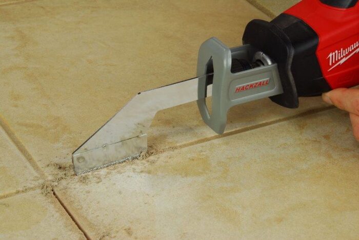 GROUT GRABBER REMOVAL BLADE in action