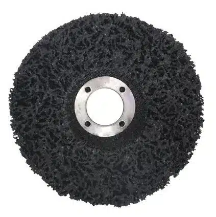 Flexible black abrasive cleaning disc with metal center for industrial polishing and surface preparation applications.