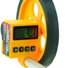 0. alt text only: Digital tachometer displaying 0.52 meters on a yellow and black tool for precise distance measurement.