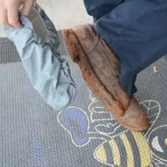 Rusted shoe being inspected for corrosion, highlighting maintenance safety.