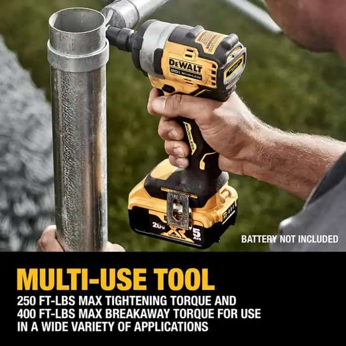 DeWalt cordless drill being used to tighten a metal pipe fitting, illustrating versatile power tools for construction and DIY projects.
