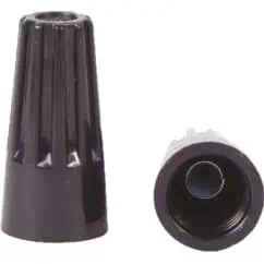 Black plastic cable gland with threaded connector and protective cap for electrical wiring, used in industrial and outdoor applications.