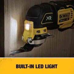 DeWalt XR cordless oscillating multi-tool with built-in LED light illuminating wood surface for precise cutting and sanding; ideal for DIY and professional renovation projects.