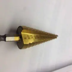 Hex shank drill bit with adjustable depth control, suitable for precise drilling tasks in woodworking and metalworking. Features marked measurements for accuracy and durability.