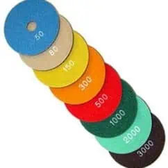 Blue abrasive grinding wheel with "50" printed, industrial sanding disc for precision grinding.