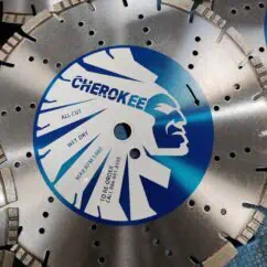 High-quality diamond blade for concrete cutting with Cherokee branding, featuring laser-etched specifications on a blue and white label. Designed for professional construction and masonry applications.