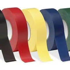 Black, red, yellow, blue, and green adhesive tapes aligned in a row, showcasing various colors and textures, suitable for electrical, craft, or industrial applications.