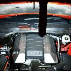 V8 engine under the hood of a sports car, showcasing high-performance automotive engineering and engine components.