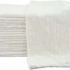 Soft white towels stacked and folded, ideal for hotel or home use, showcasing luxury and comfort, perfect for cleaning, bathing, or spa environments.