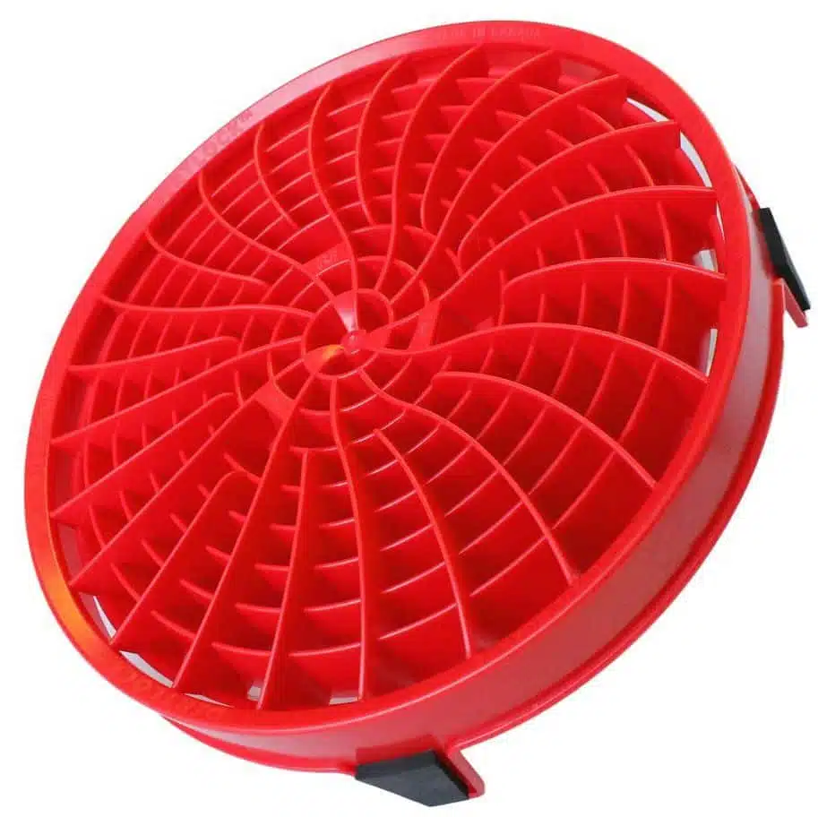 Red plastic spiral drain cover for sink or shower drain filters and hair catchers with adjustable fitting.